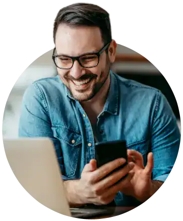 man with laptop and phone